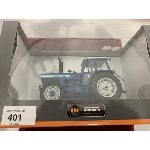 401 - A BOXED UNIVERSAL HOBBIES DIE CAST FORD TRACTOR 1:32