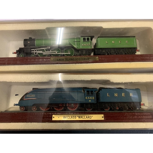 453 - A GROUP OF FOUR MODEL TRAINS ON WOODEN PLINTHS TO INCLUDE SNCF 4-6-4 CLASS