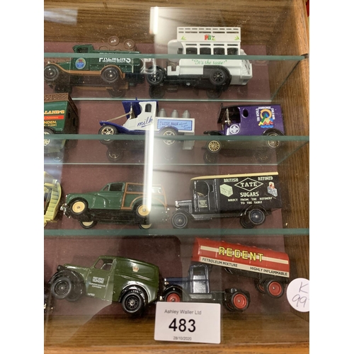 483 - AN ASSORTMENT OF DIE CAST MODEL REPLICA VEHICLES IN A DISPLAY CASE TO INCLUDE A 'JAMESON' VAN AND A ... 