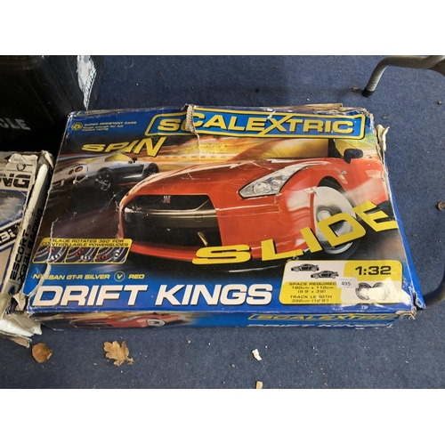 495 - TWO BOXES OF SCALEXTRIC TO INCLUDE FORD ESCORT XR3I AND DRIFT KINGS