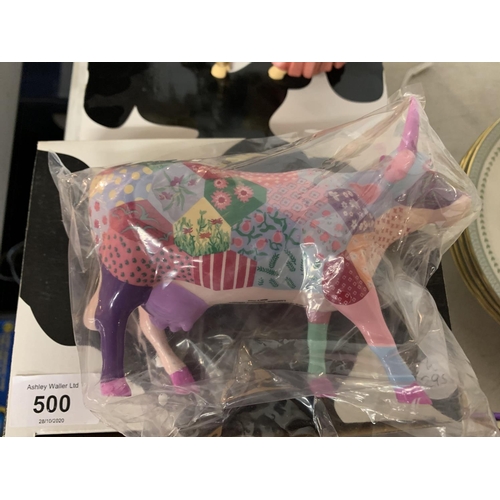 500 - TWO COW PARADE ORNAMENTS AND TWO MINIATURE SHOE DESIGNS