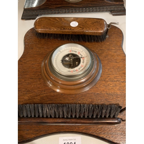 1004 - TWO VINTAGE WOODEN MANTEL CLOCKS AND A WOODEN BAROMETER WITH CLOTHES BRUSHES