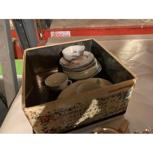 1007 - A LARGE TIN CONTAINING A CHILD'S TEA SET