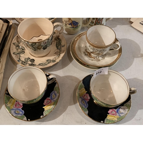 852 - A COLLECTION OF TEAWARES TO INCLUDE A TEAPOT, LARGE JUG, SEVERAL CUPS AND SAUCERS AND SOME GLASS