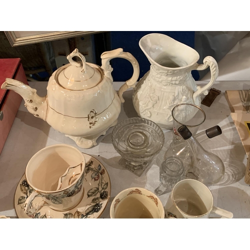 852 - A COLLECTION OF TEAWARES TO INCLUDE A TEAPOT, LARGE JUG, SEVERAL CUPS AND SAUCERS AND SOME GLASS