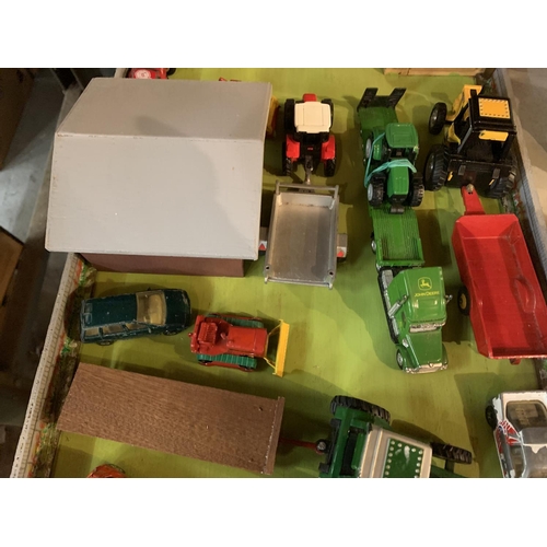 973 - A WOODEN FARM YARD LAYOUT WITH SHEDS AND DIECAST VEHICLES TO INCLUDE A JOHN DEERE LOW LOADER WAGON A... 