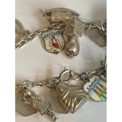 578 - A SILVER CHARM BRACELET WITH SILVER CHARMS