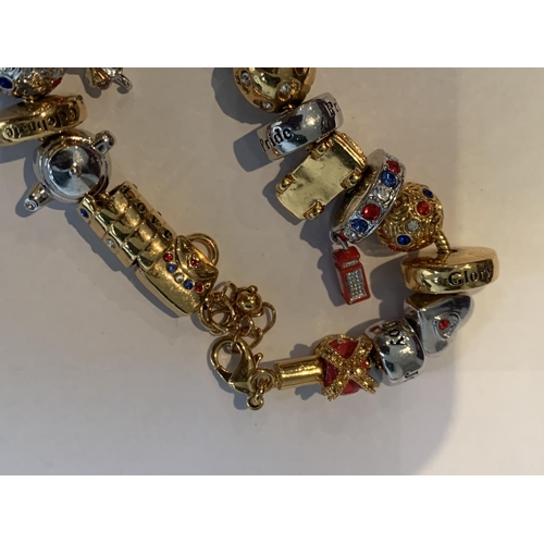 579 - A BRADFORD EXCHANGE ENGLAND BRACELET WITH EIGHTEEN CHARMS