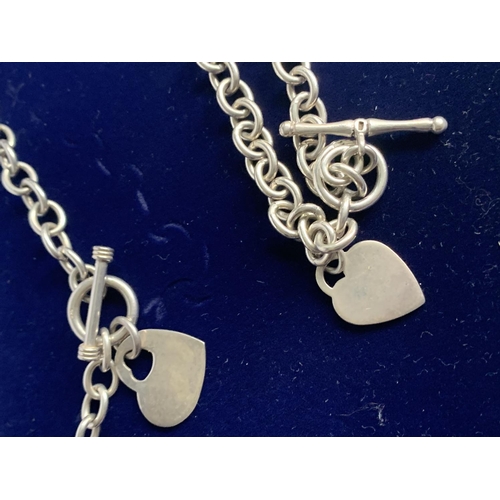 589 - A BOXED SILVER NECKLACE AND BRACELET SET