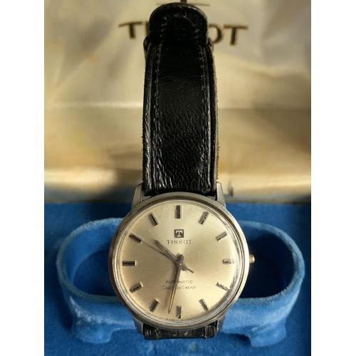 594 - A VINTAGE BOXED TISSOT AUTOMATIC SEASTAR SEVEN IN WORKING ORDER (MINOR SCRATCHING TO FACE)