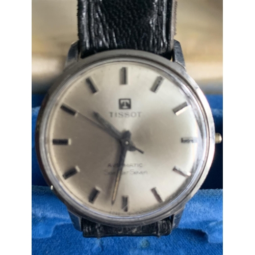 594 - A VINTAGE BOXED TISSOT AUTOMATIC SEASTAR SEVEN IN WORKING ORDER (MINOR SCRATCHING TO FACE)