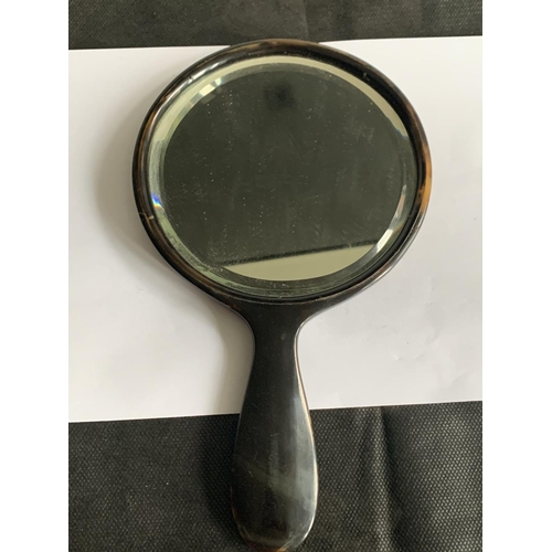 599 - A FAUX TORTOISESHELL BEVEL EDGED HAND MIRROR