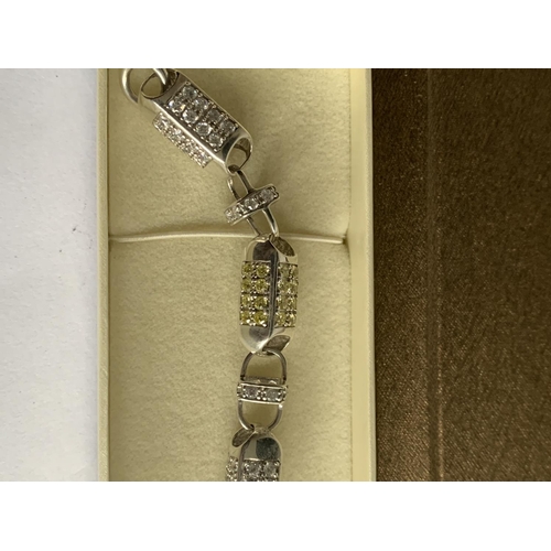 604 - A SILVER SQUARE LINKED COLOURED STONE BRACELET