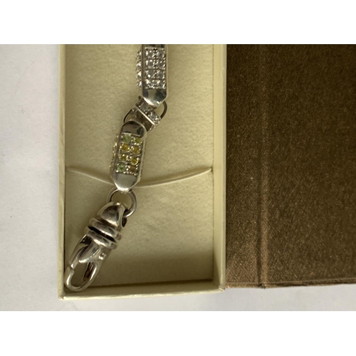 604 - A SILVER SQUARE LINKED COLOURED STONE BRACELET