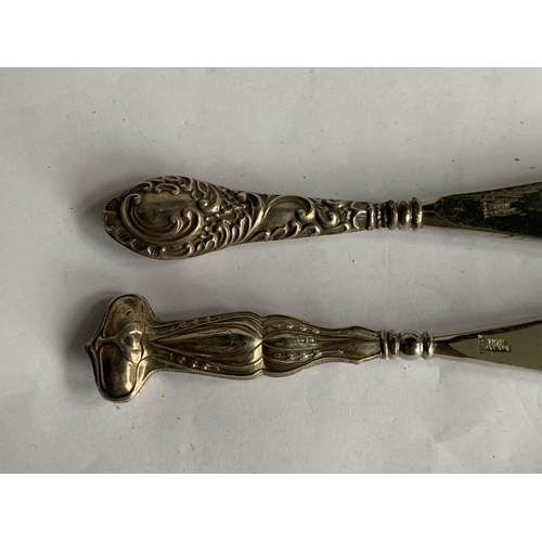 612 - TWO SHOEHORNS WITH HALLMARKED BIRMINGHAM SILVER HANDLES 1904 AND 1911