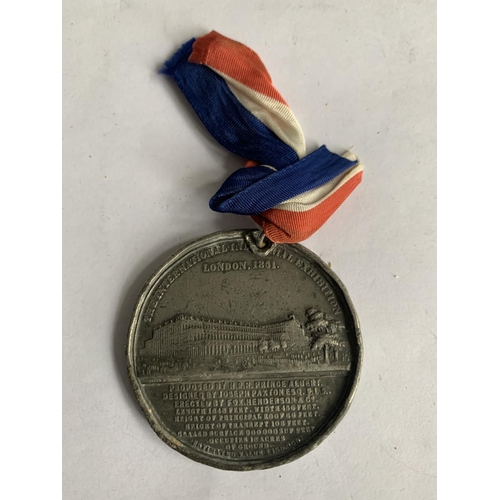 613 - AN 1851 GREAT EXHIBITION MEDAL WITH RIBBON