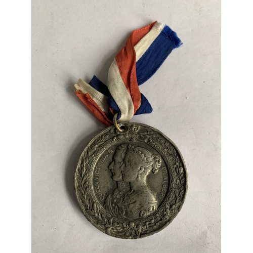 613 - AN 1851 GREAT EXHIBITION MEDAL WITH RIBBON