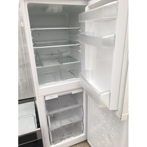 1712 - A WHITE BEKO UPRIGHT FRIDGE FREEZER BELIEVED IN WORKING ORDER BUT NO WARRANTY