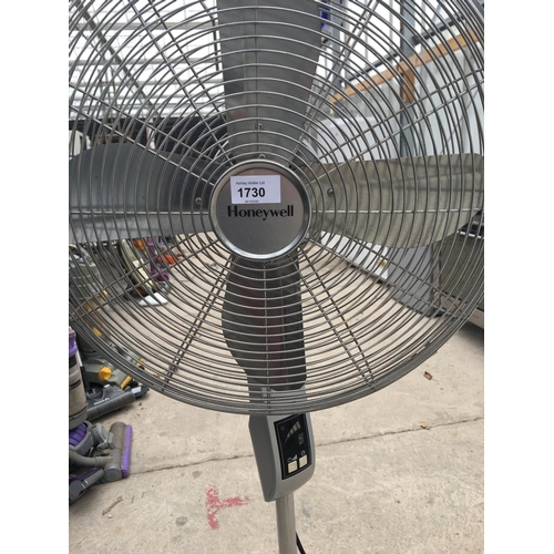 1730 - AN UPRIGHT HONEYWELL FLOOR FAN BELIEVED IN WORKING ORDER BUT NO WARRANTY