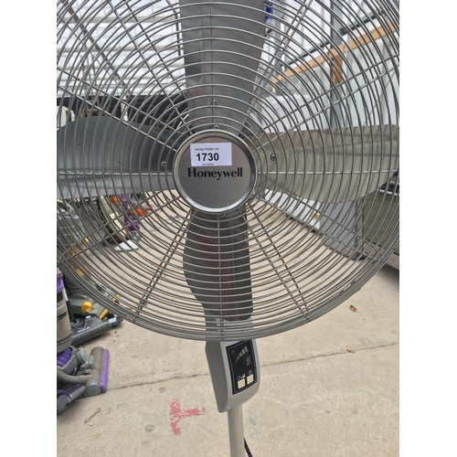 1730 - AN UPRIGHT HONEYWELL FLOOR FAN BELIEVED IN WORKING ORDER BUT NO WARRANTY