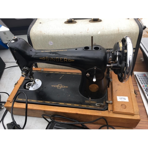 1779 - A VINTAGE SINGER SEWING MACHINE COPLETE WITH CASE