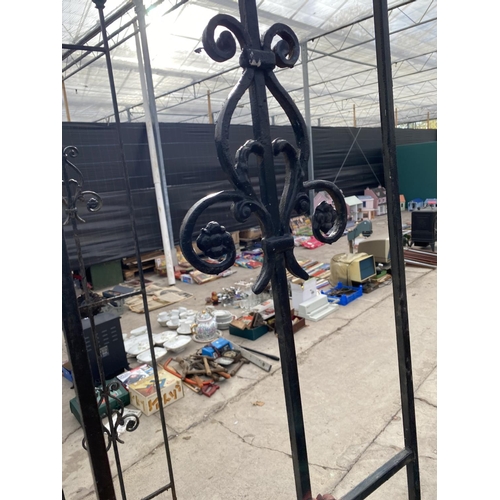 1639 - A METAL GARDEN ARCH WITH WROUGHT IRON DECORATION