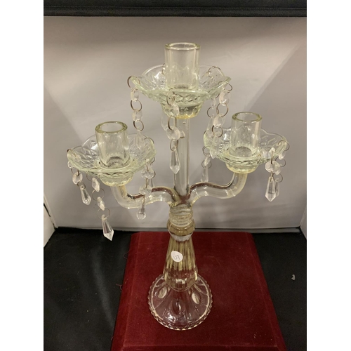 60 - A VINTAGE GLASS THREE CANDLESTICK WITH DROP GLASS DETAIL