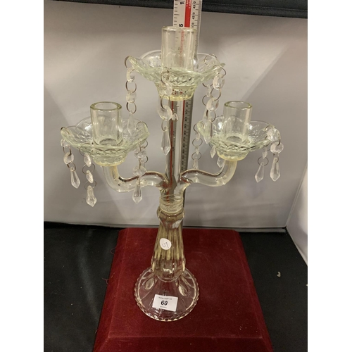 60 - A VINTAGE GLASS THREE CANDLESTICK WITH DROP GLASS DETAIL