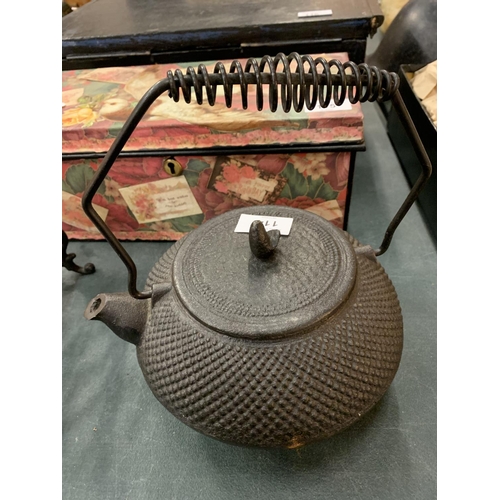 114 - A CAST IRON FIRESIDE KETTLE