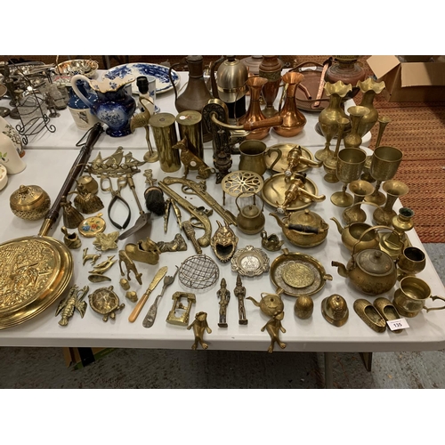 135 - A LARGE QUANTITY OF BRASS WARE TO INCLUDE GOBLETS, VASES AND A CORKSCREW