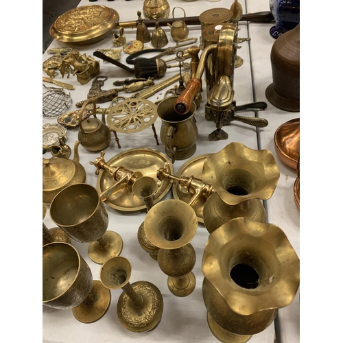 135 - A LARGE QUANTITY OF BRASS WARE TO INCLUDE GOBLETS, VASES AND A CORKSCREW