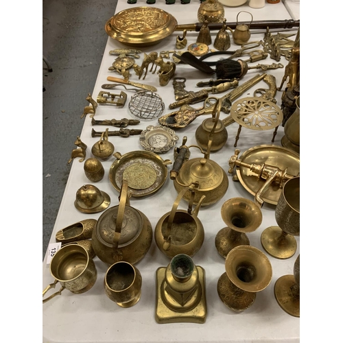 135 - A LARGE QUANTITY OF BRASS WARE TO INCLUDE GOBLETS, VASES AND A CORKSCREW