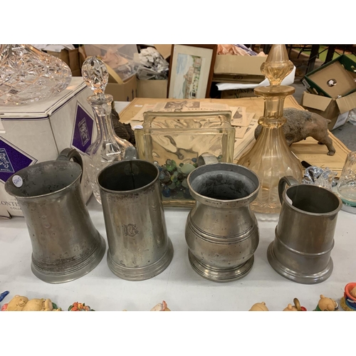 150 - A GROUP OF FOUR PEWTER TANKARDS