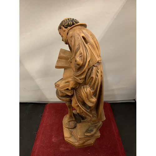 66 - A CARVED WOODEN FIGURINE OF AN HISTORICAL SCHOLAR