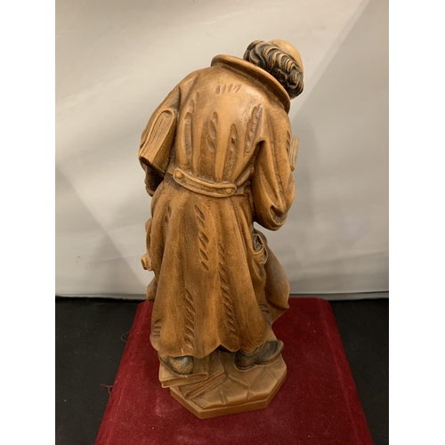 66 - A CARVED WOODEN FIGURINE OF AN HISTORICAL SCHOLAR