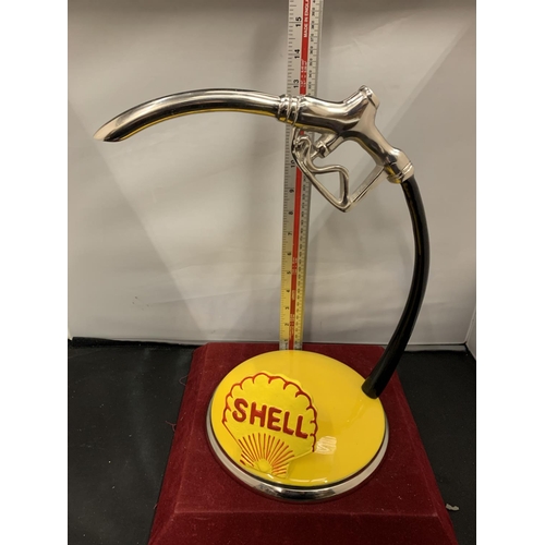 67 - A SHELL PETROL PUMP HANDLE ADVERTISING SIGN ON A BASE