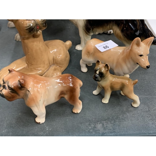 86 - AN ASSORTMENT OF EIGHT CERAMIC DOG FIGURES