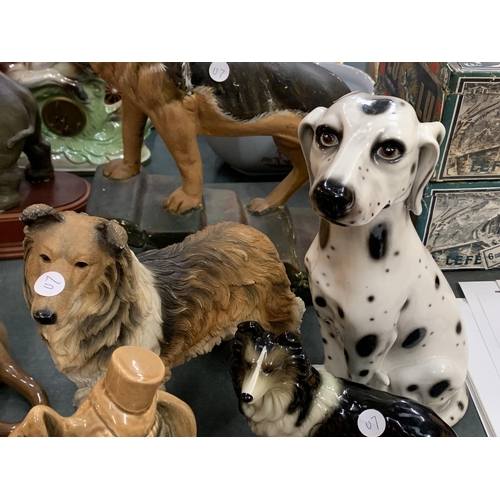 86 - AN ASSORTMENT OF EIGHT CERAMIC DOG FIGURES