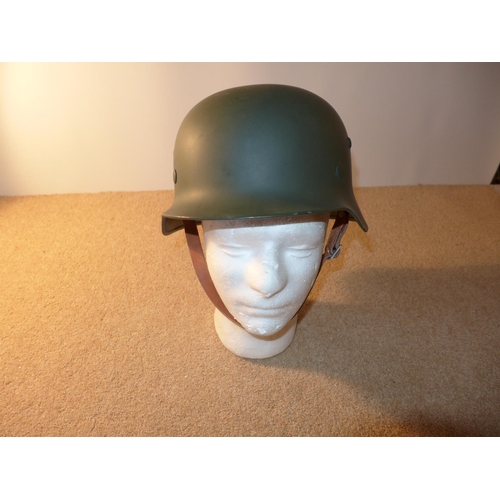 335 - A GERMAN HELMET AND LINER LATE 20TH CENTURY