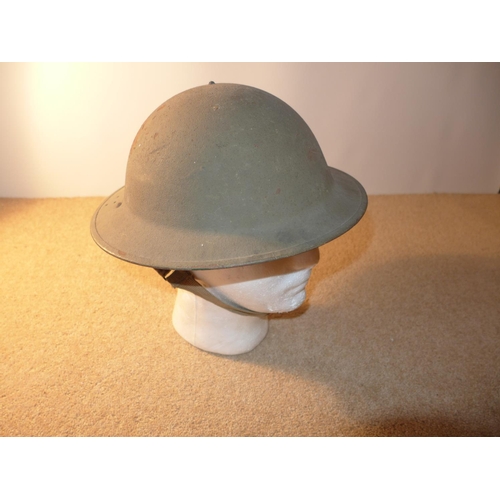 340 - A WORLD WAR II PERIOD BRITISH STEEL HELMET AND LINER