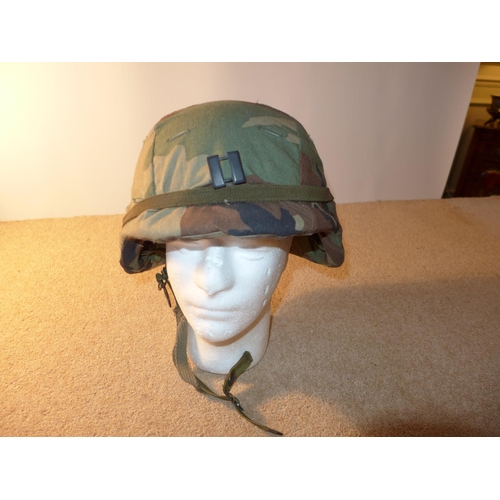 342 - AN ARMY HELMET, WITH CAMOFLAGE COVER