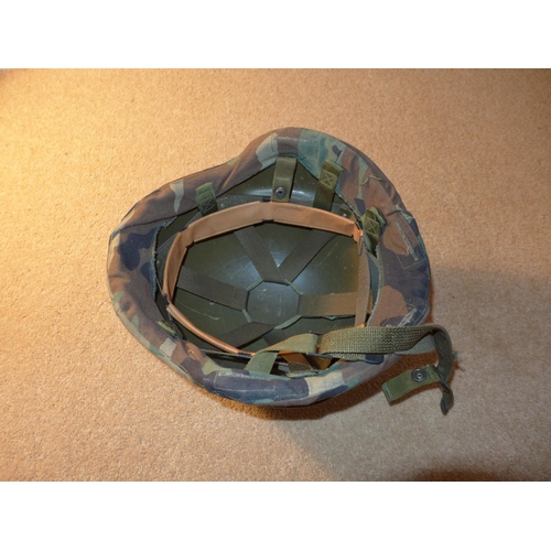 342 - AN ARMY HELMET, WITH CAMOFLAGE COVER