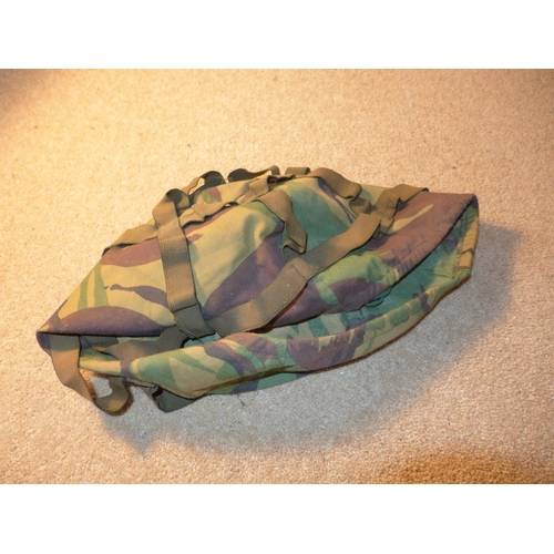 344 - A BRITISH ARMY STEEL HELMET WITH LINING AND NET COVER TOGETHER WITH A CAMOFLAGE COVER