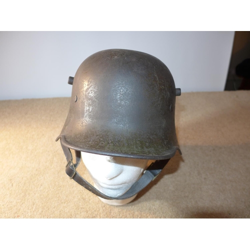 410 - A MI6 WWI GERMAN COMBAT HELMET WITH BLACK LEATHER LINING