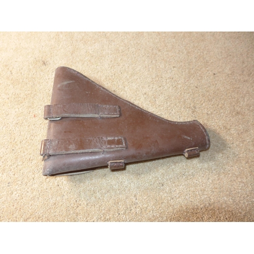 413 - A BROWN LEATHER PISTOL HOLSTER