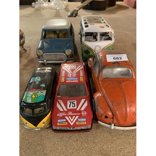 882 - FIVE VINTAGE MODEL VEHICLES TO INCLUDE TWO CAMPER VANS AND A MINI