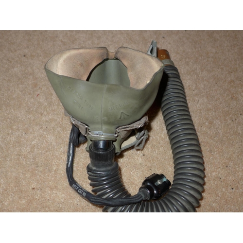 469 - A LEATHER HELMET AND A MILITARY MARKED OXYGEN MASK