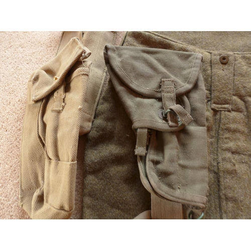 484 - A CAMOFLAGE UNIFORM, TWO CANVAS AMMUNITION POUCHES, WATER BOTTLE, CANVAS PISTOL HOLSTER ETC