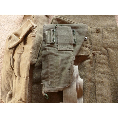 484 - A CAMOFLAGE UNIFORM, TWO CANVAS AMMUNITION POUCHES, WATER BOTTLE, CANVAS PISTOL HOLSTER ETC