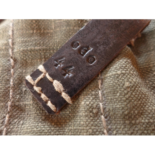 485 - A THREE SECTION MAGAZINE POUCH, THE LEATHER STRAPS MARKED WITH AN EAGLE AND SWASTIKA